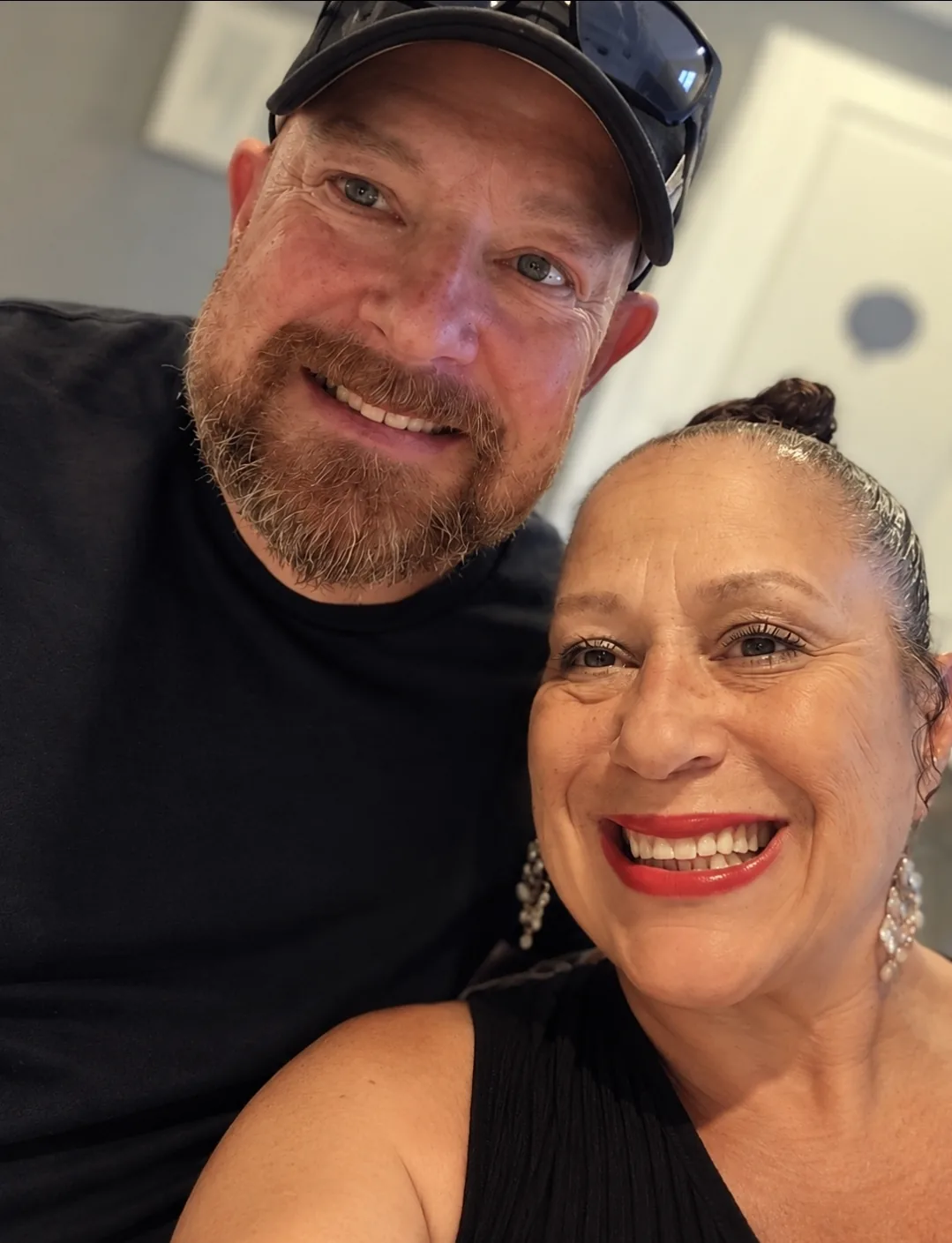 Evee B and her husband Zig smiling together