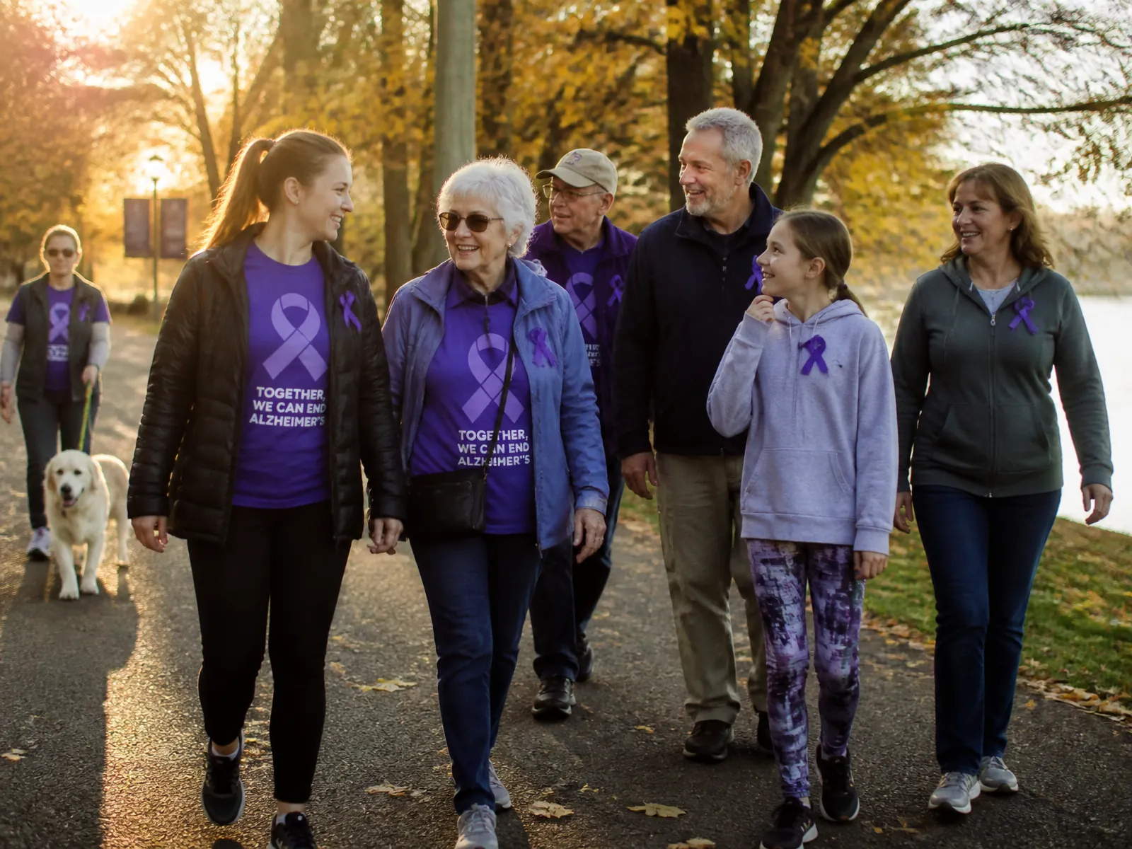 Families walking together on a park path in autumn during the Walk to End Alzheimer's in Yakima